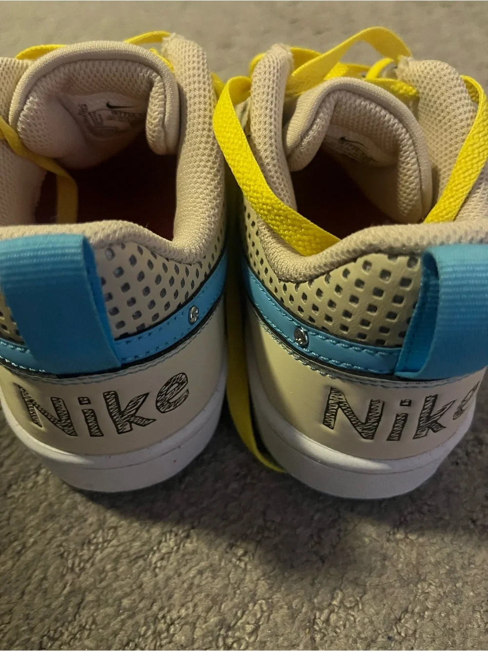 Nike woman 6.5 w / 5y Beige Sneakers with Blue Swoosh and Yellow Laces
